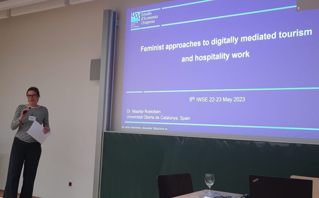 Presentation screen with the title "Feminist approaches to digitally mediated tourism and hospitality work" presenter